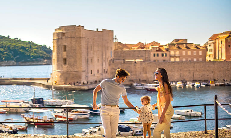 a man and woman posing for a picture in a city