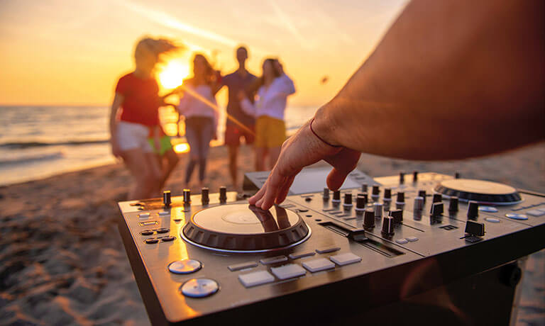 a group of people playing a game on a beach