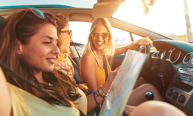 a group of women in a car