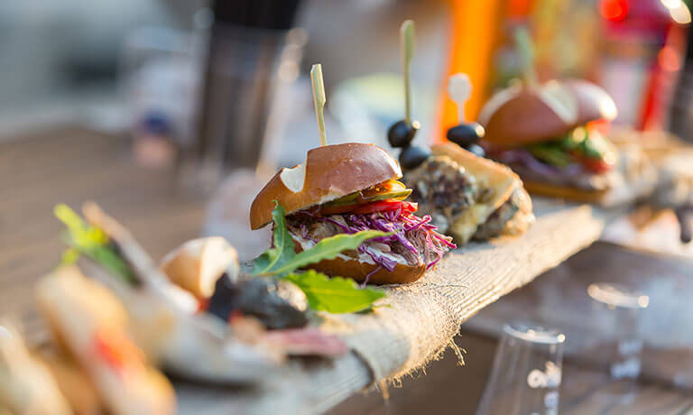 a group of hamburgers on a table