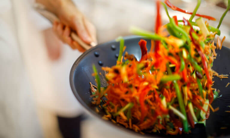 a person holding a plate of food