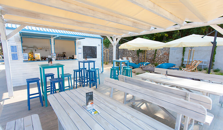 a patio with tables and chairs