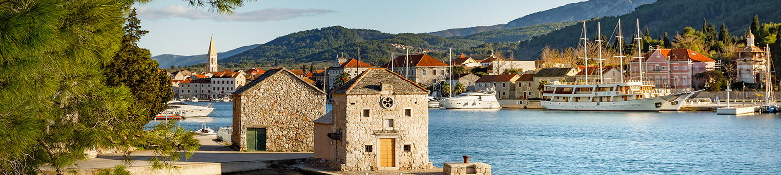 a small building next to a body of water