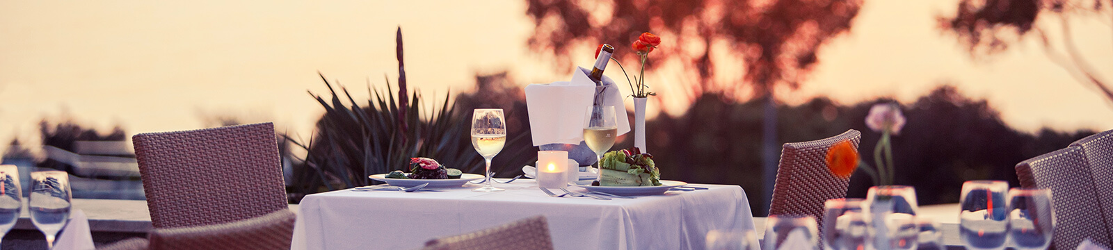 a table with glasses and candles on it